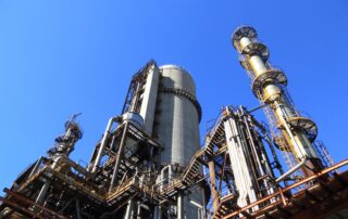 View of factory against blue sky