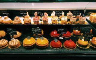 Shelves of assorted cake in a bakeshop