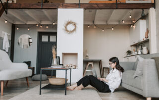 Woman sitting on the floor using a laptop