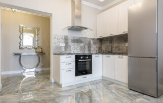 Modern kitchen interior with cabinets and refrigerator at home