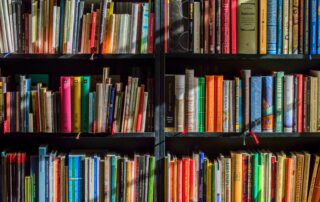 Books in black wooden book shelf
