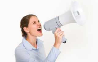 Young woman with a megaphone