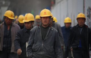 Group of persons wearing yellow safety helmet during daytime
