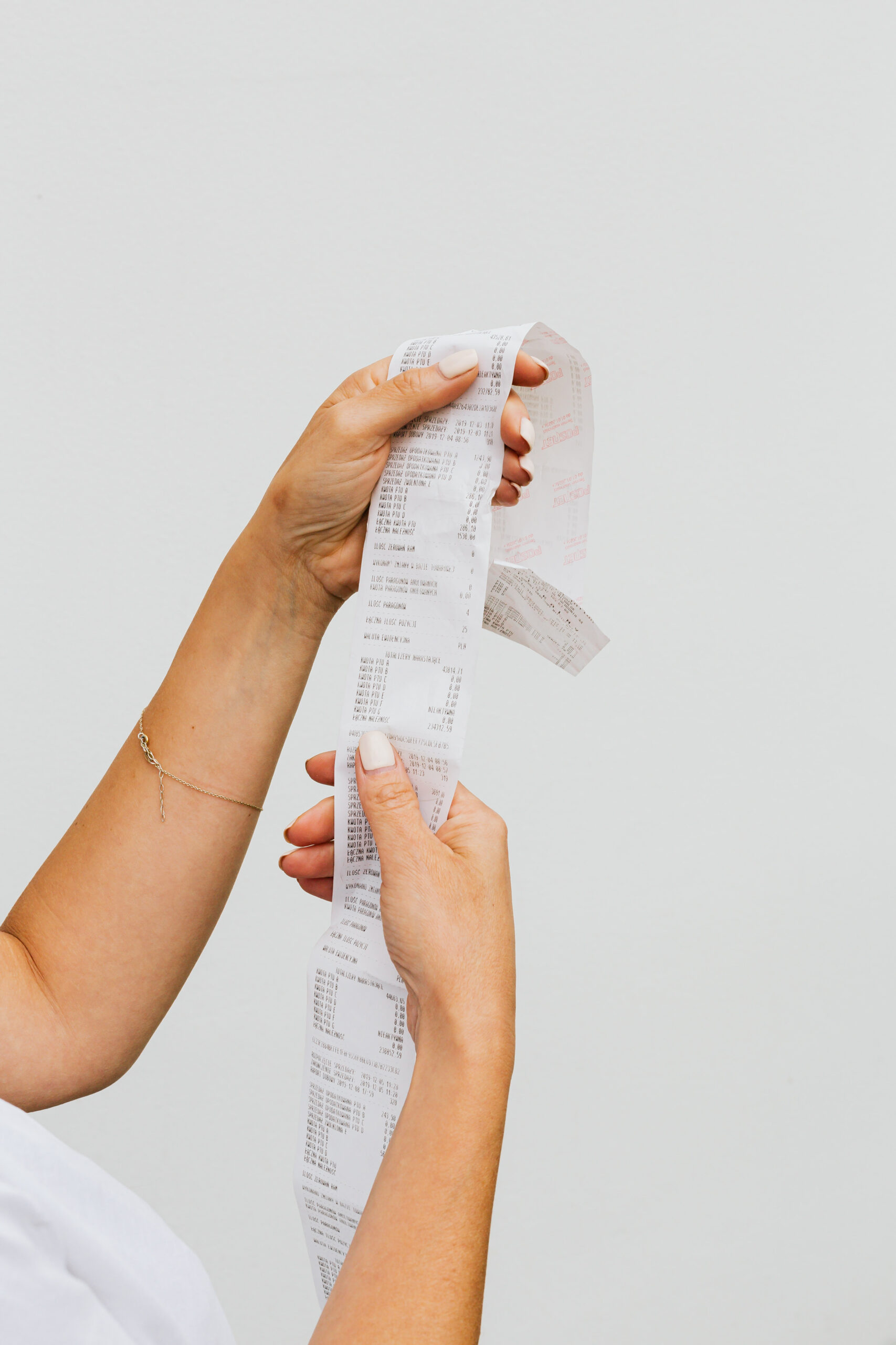 Person holding white printer paper