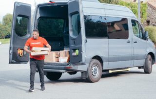 A man standing near the van