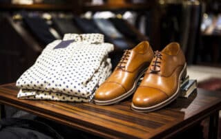 Pair of brown leather casual shoes on table